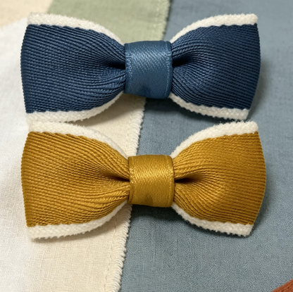 SilkyCo’s chenille - trimmed pet bow tie clips & hair ties, designed exclusively for small long - haired dog breeds like Yorkshire Terriers, Shih Tzus, and Malteses. These accessories feature soft chenille edges and come in elegant color combinations (gold - white, navy - white). They’re perfect for adding a stylish touch to your pet’s look during parties or daily wear, with options for both clips (secure hold on fur) and hair ties (gentle on delicate coats), ensuring comfort and charm.