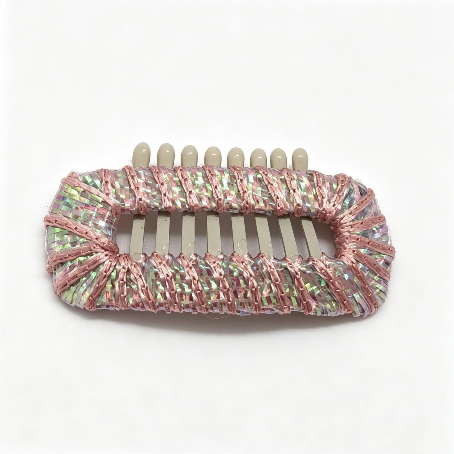 Petal Rose Iridescent Sheen dog barrette, a soft pink reflective hair clip for Shih Tzu face-framing styling.