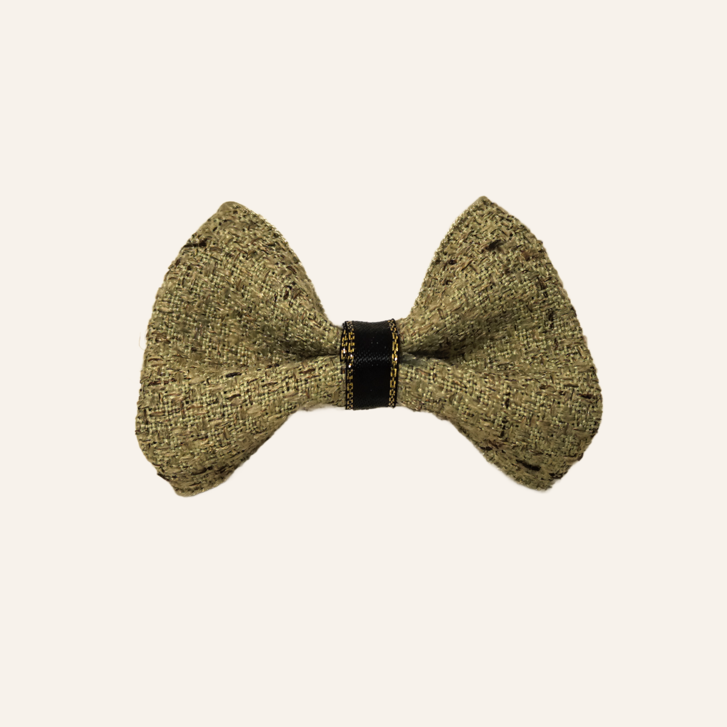 SilkyCo Detachable Tweed Bow in Sage Green with black band and gold stitching, flat lay.