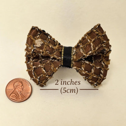 SilkyCo Gala Collection Detachable Woven Mesh Pet Hair Bow size chart. The image clearly shows the dog bow's actual size of 2 inches (5cm) alongside a US penny (1-inch diameter) for scale, on a pure white background.