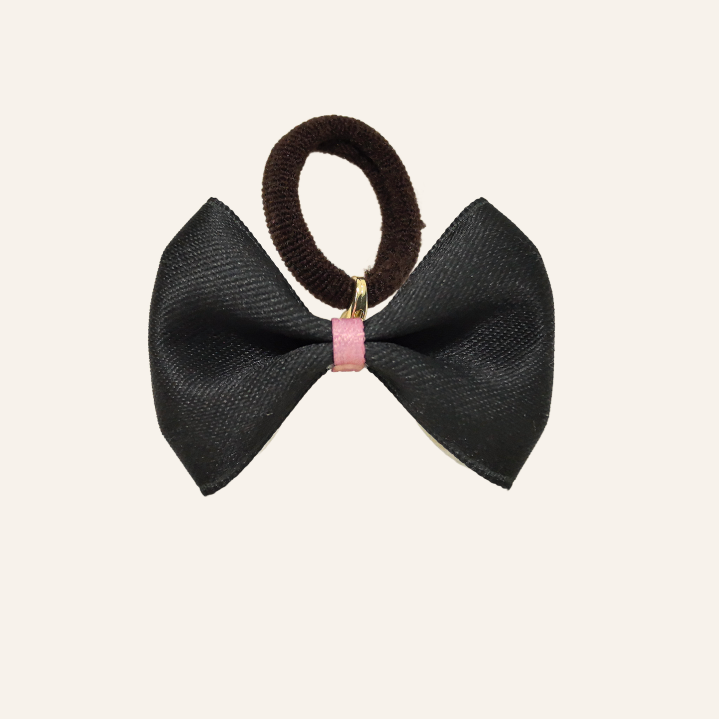 SilkyCo Detachable Two-Tone Pet Bow in Black. Fashion-forward statement piece with a pink accent ribbon and dark brown elastic tie.