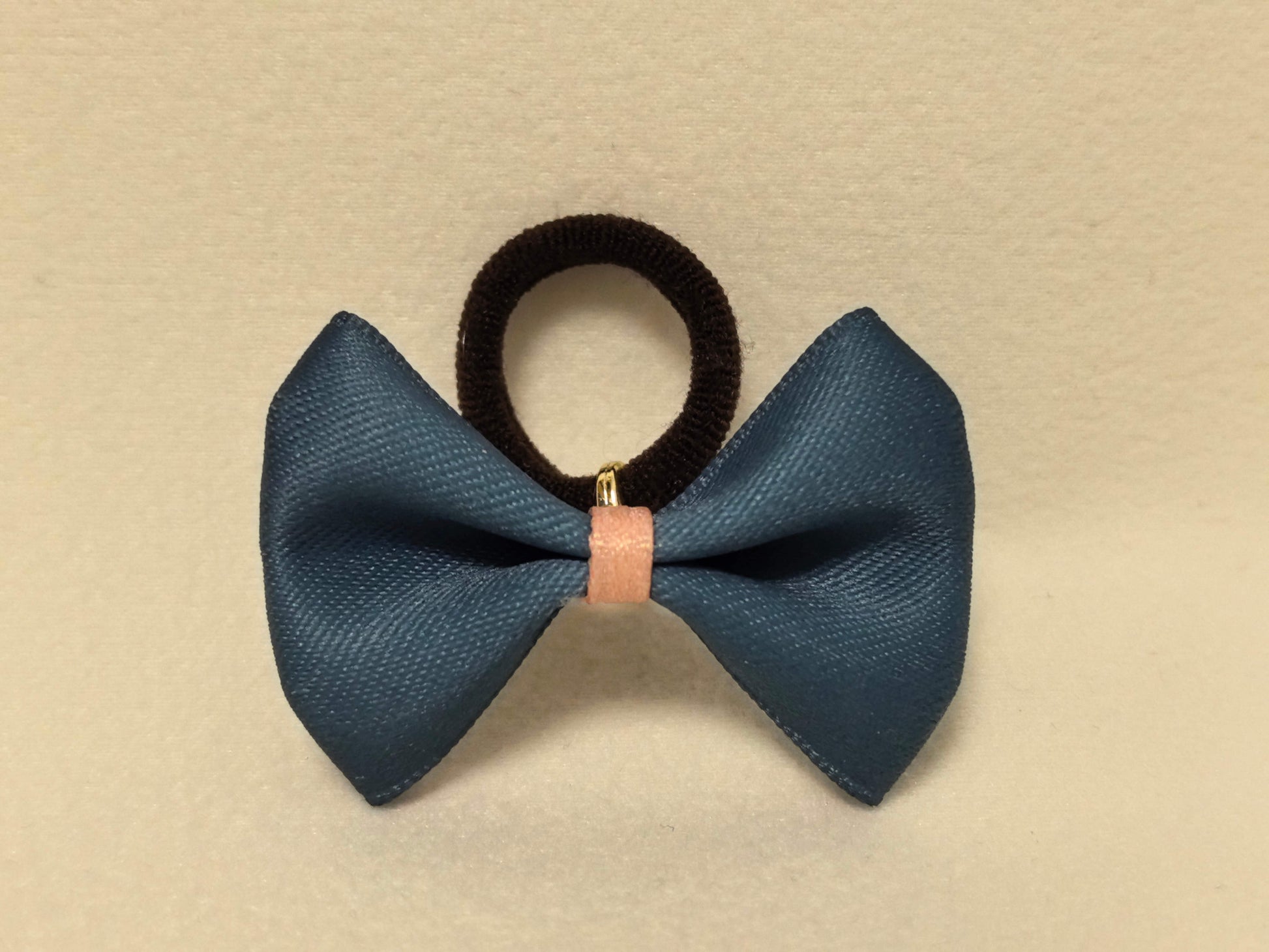 SilkyCo Two-Tone Bow in Navy Blue and Blush Pink. Soft, sophisticated satin finish with a black center knot.