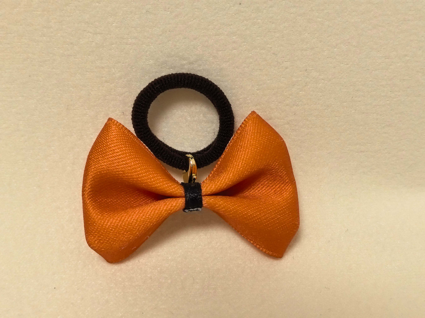 Warm Two-Tone Bow in Orange and Cream (Black accent). Cheerful and stylish, perfect for a pop of color.