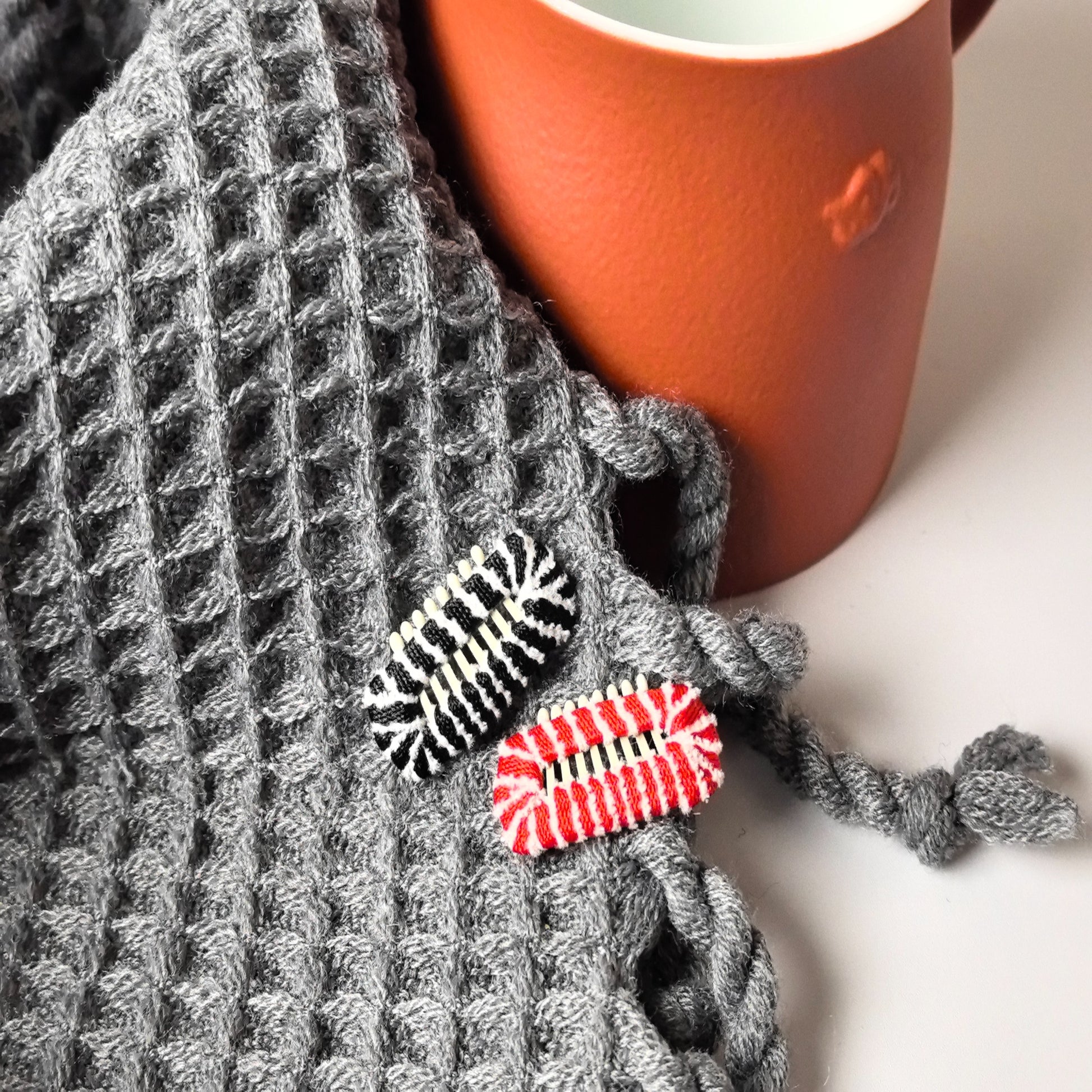Close-up of soft felted dog barrettes for long-haired small breeds